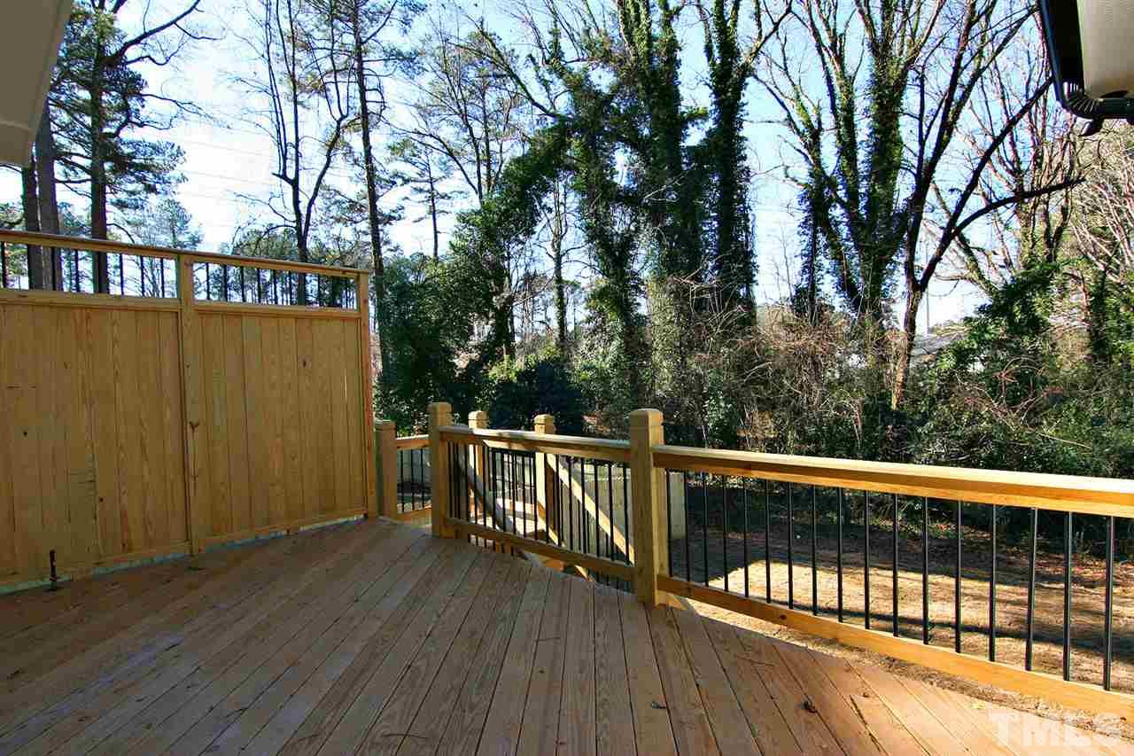 915 Marilyn Drive Raleigh, NC 27607 - Photo 5 of 25 a view of balcony with wooden floor and fence