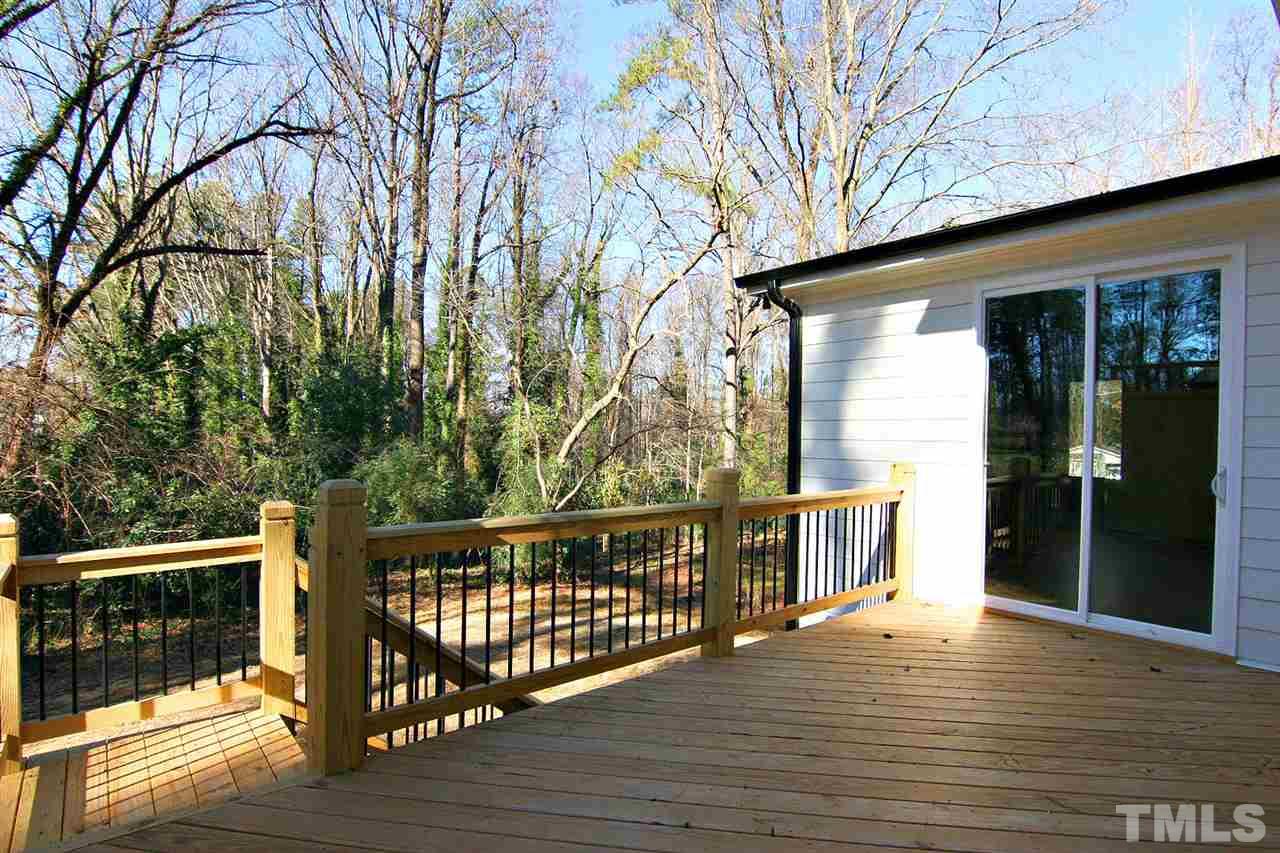 915 Marilyn Drive Raleigh, NC 27607 - Photo 6 of 25 a view of a street with wooden stairs
