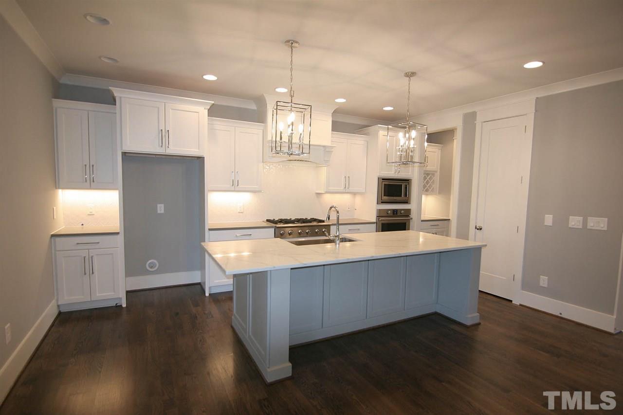 915 Marilyn Drive Raleigh, NC 27607 - Photo 8 of 25 a view of kitchen with refrigerator and window