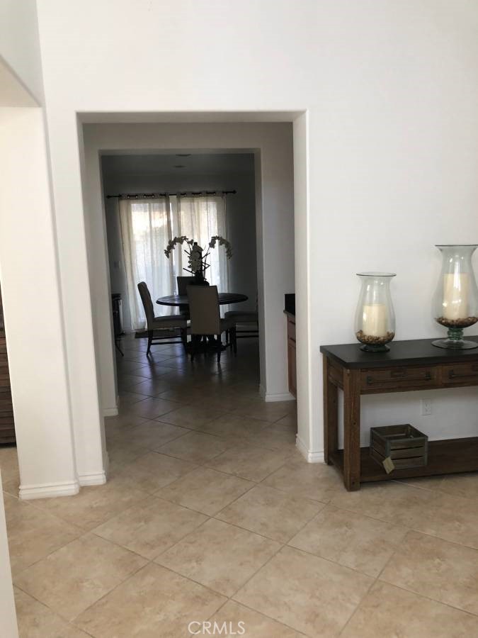 14653 Meadowsweet Drive Eastvale, CA 92880 - Photo 4 of 15 a view of a livingroom with furniture and a window