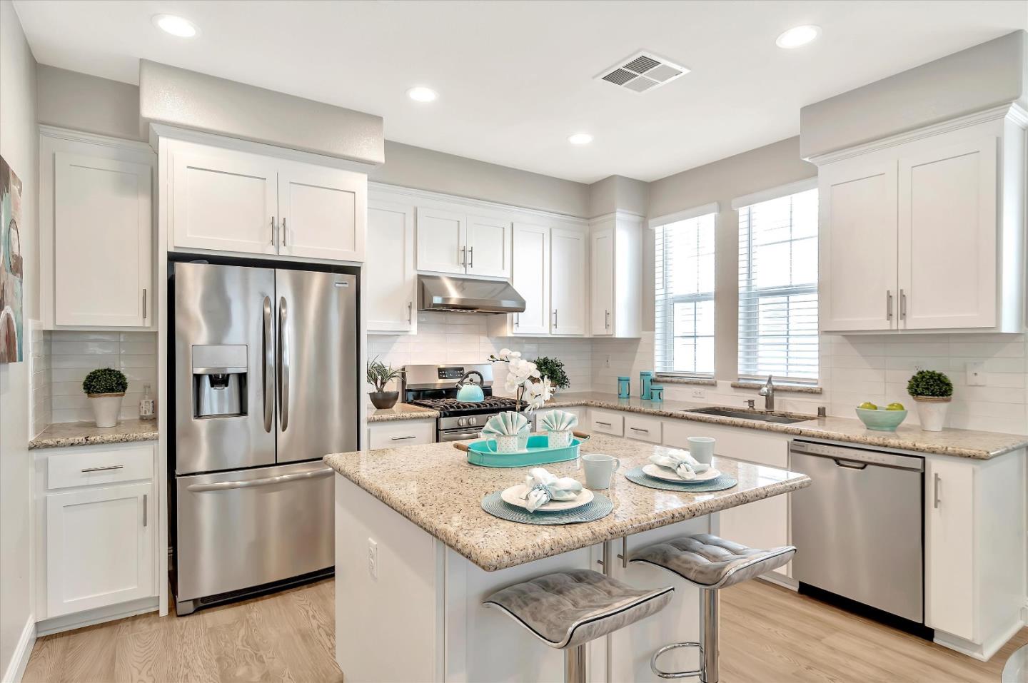 305 Wild Rose Way Milpitas, CA 95035 - Photo 1 of 41 a kitchen with refrigerator cabinets and wooden floor