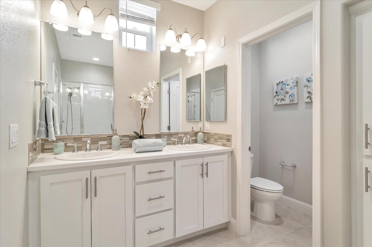 305 Wild Rose Way Milpitas, CA 95035 - Photo 13 of 41 a bathroom with a double vanity sink mirror and toilet