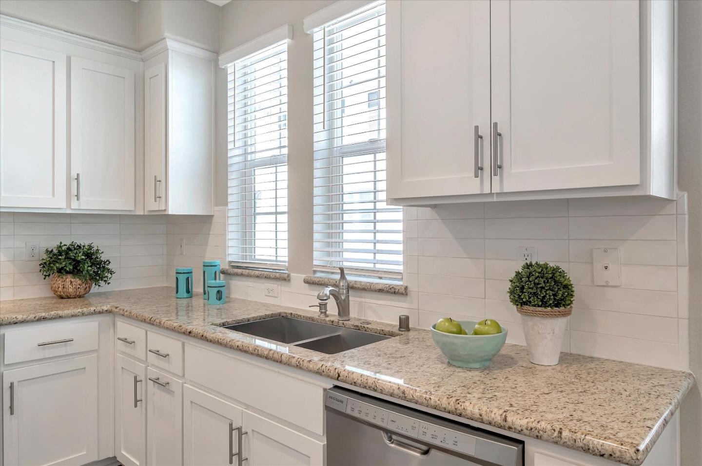 305 Wild Rose Way Milpitas, CA 95035 - Photo 3 of 41 a kitchen with granite countertop a sink white cabinets and a window