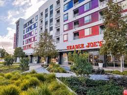 305 Wild Rose Way Milpitas, CA 95035 - Photo 34 of 41 a front view of multi story residential apartment building with yard and retail shops