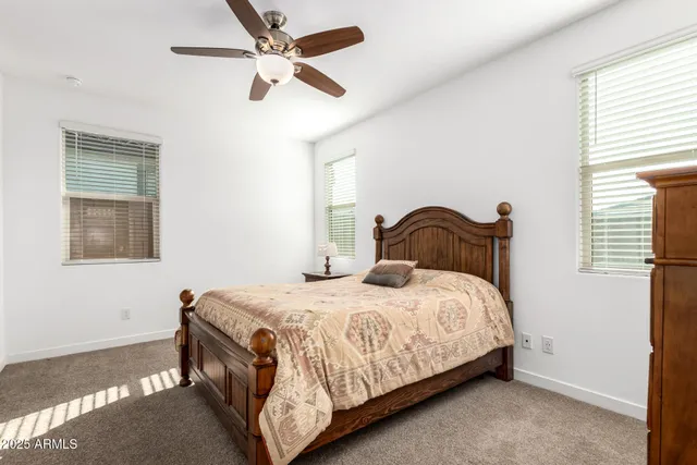 a bedroom with a bed and window