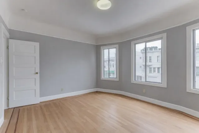 a view of an empty room with a window