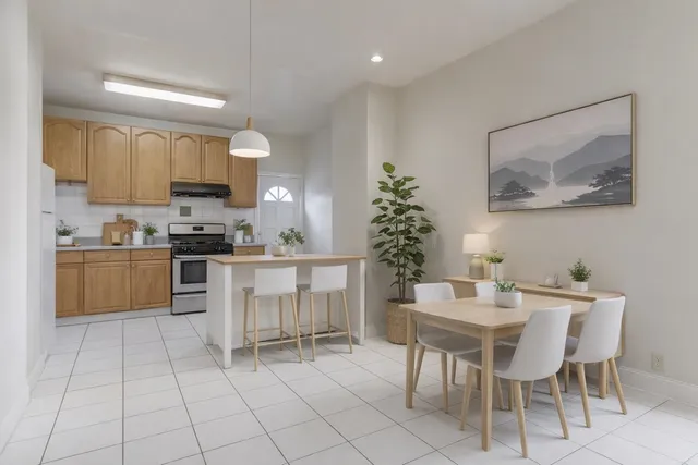 a kitchen with a cabinets and chairs