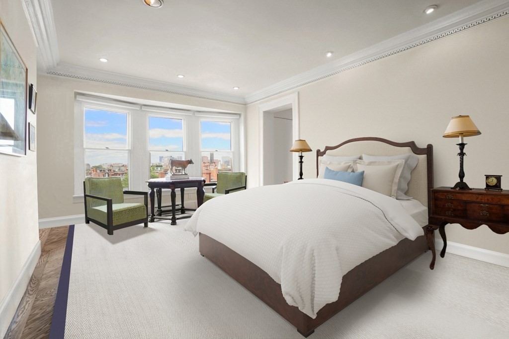 333 Commonwealth Avenue, Unit PH22 Boston, MA 02115 - Photo 16 of 42 a spacious bedroom with a bed and a night stand