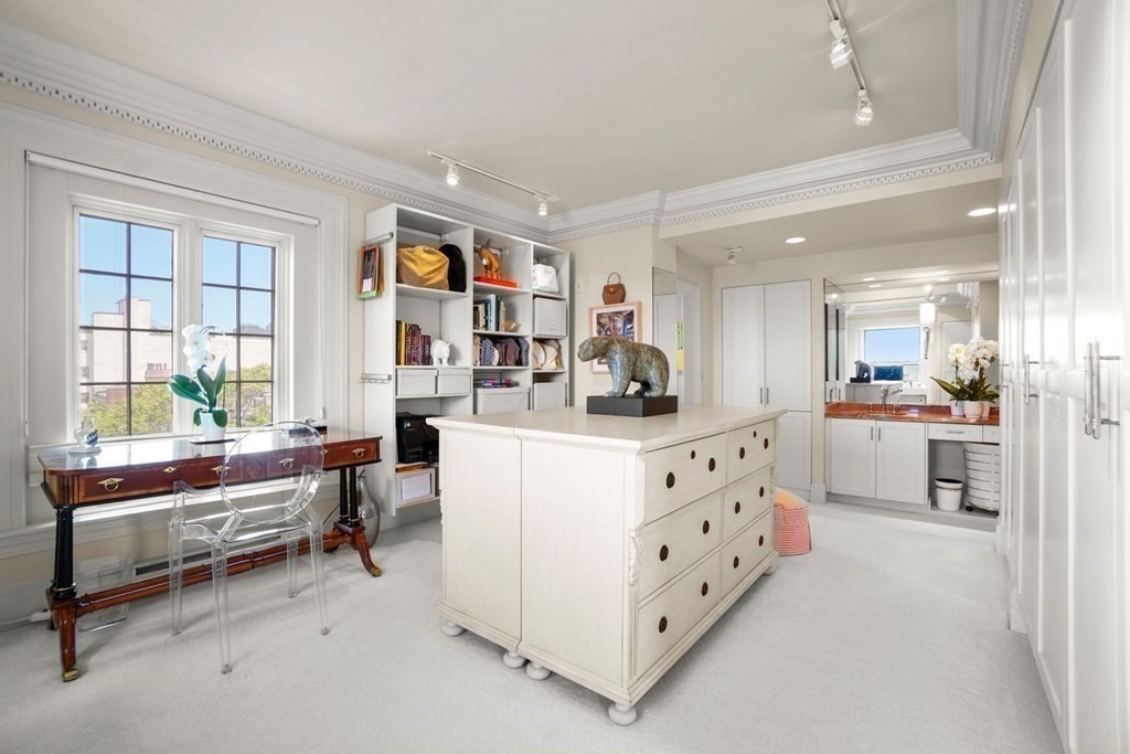 333 Commonwealth Avenue, Unit PH22 Boston, MA 02115 - Photo 18 of 42 a living room with furniture and windows