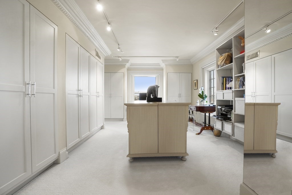 333 Commonwealth Avenue, Unit PH22 Boston, MA 02115 - Photo 20 of 42 a living room with furniture and a kitchen