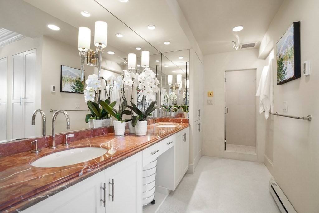 333 Commonwealth Avenue, Unit PH22 Boston, MA 02115 - Photo 21 of 42 a bathroom with a sink double vanity and a mirror