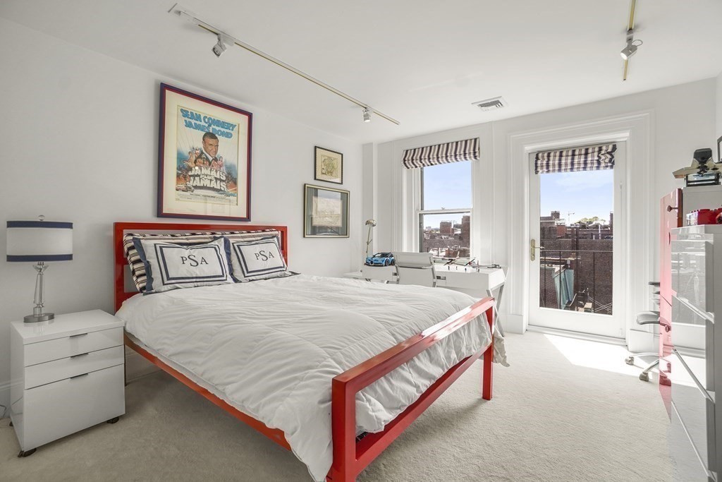 333 Commonwealth Avenue, Unit PH22 Boston, MA 02115 - Photo 22 of 42 a bedroom with a bed and a large window