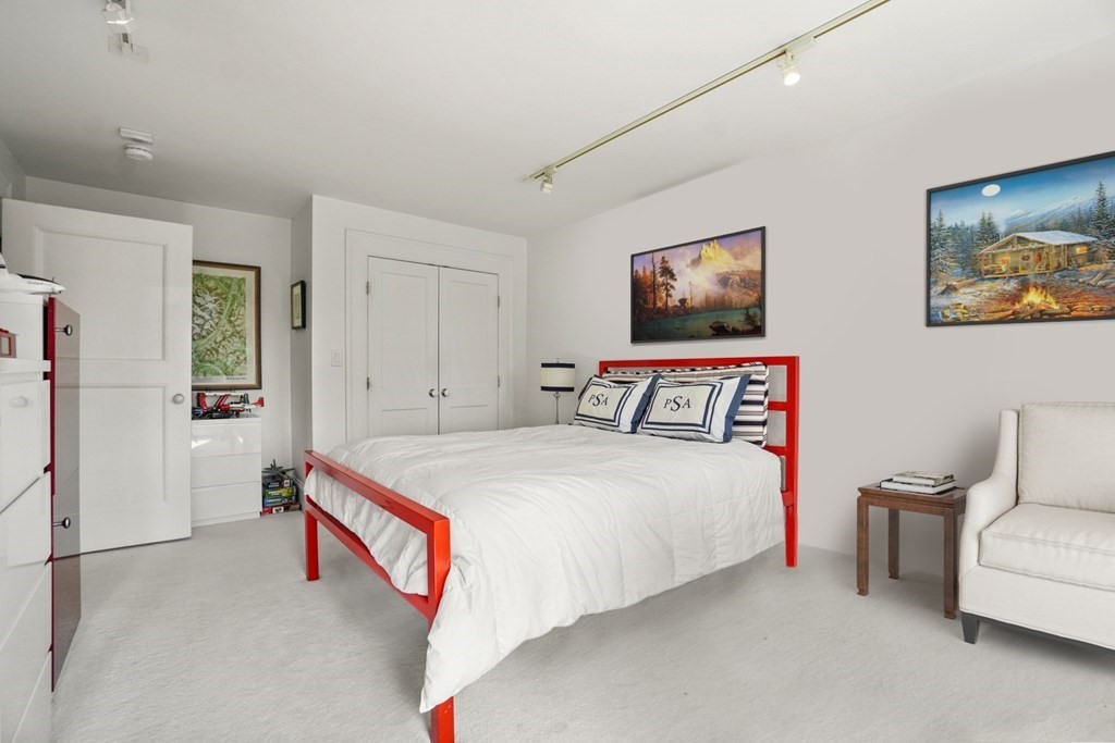 333 Commonwealth Avenue, Unit PH22 Boston, MA 02115 - Photo 23 of 42 a bedroom with bed and a couch