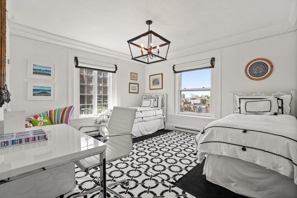 333 Commonwealth Avenue, Unit PH22 Boston, MA 02115 - Photo 24 of 42 a bedroom with furniture and a window