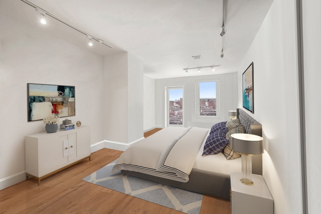 333 Commonwealth Avenue, Unit PH22 Boston, MA 02115 - Photo 26 of 42 a bedroom with a bed and a large mirror