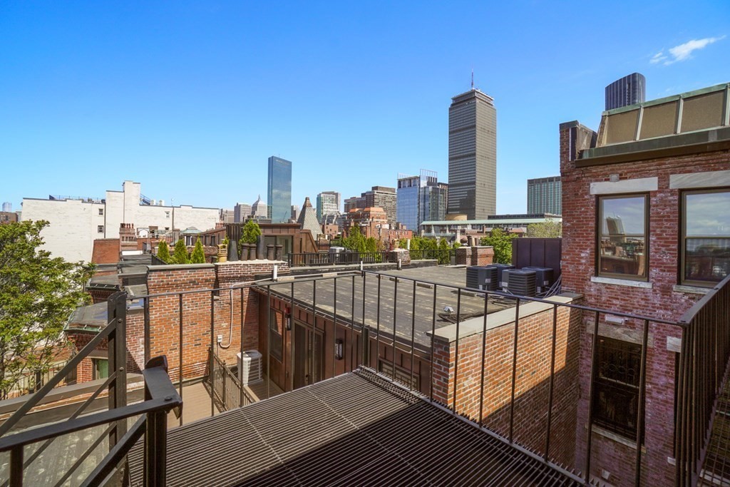 333 Commonwealth Avenue, Unit PH22 Boston, MA 02115 - Photo 9 of 42 a view of a balcony with city view