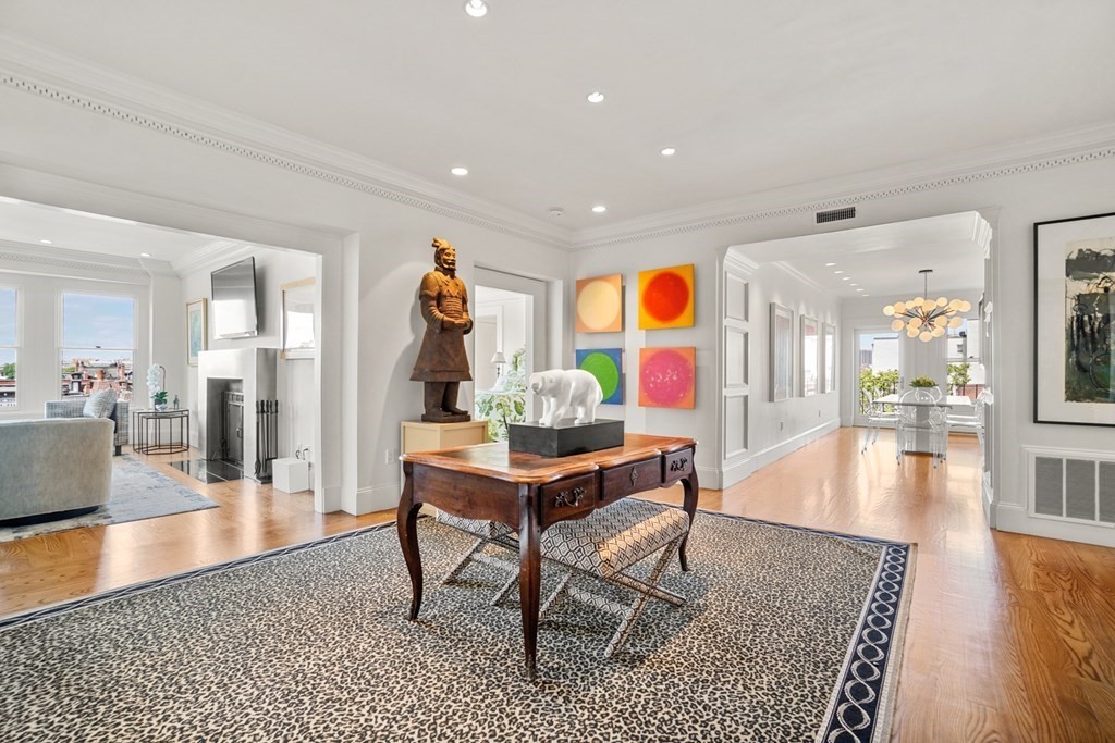 333 Commonwealth Avenue, Unit PH22 Boston, MA 02115 - Photo 10 of 42 a living room with furniture and wooden floor
