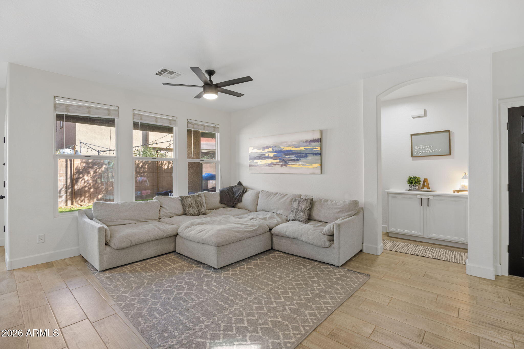 3458 East Robin Lane Gilbert, AZ 85296 - Photo 13 of 32 a living room with furniture and a large window