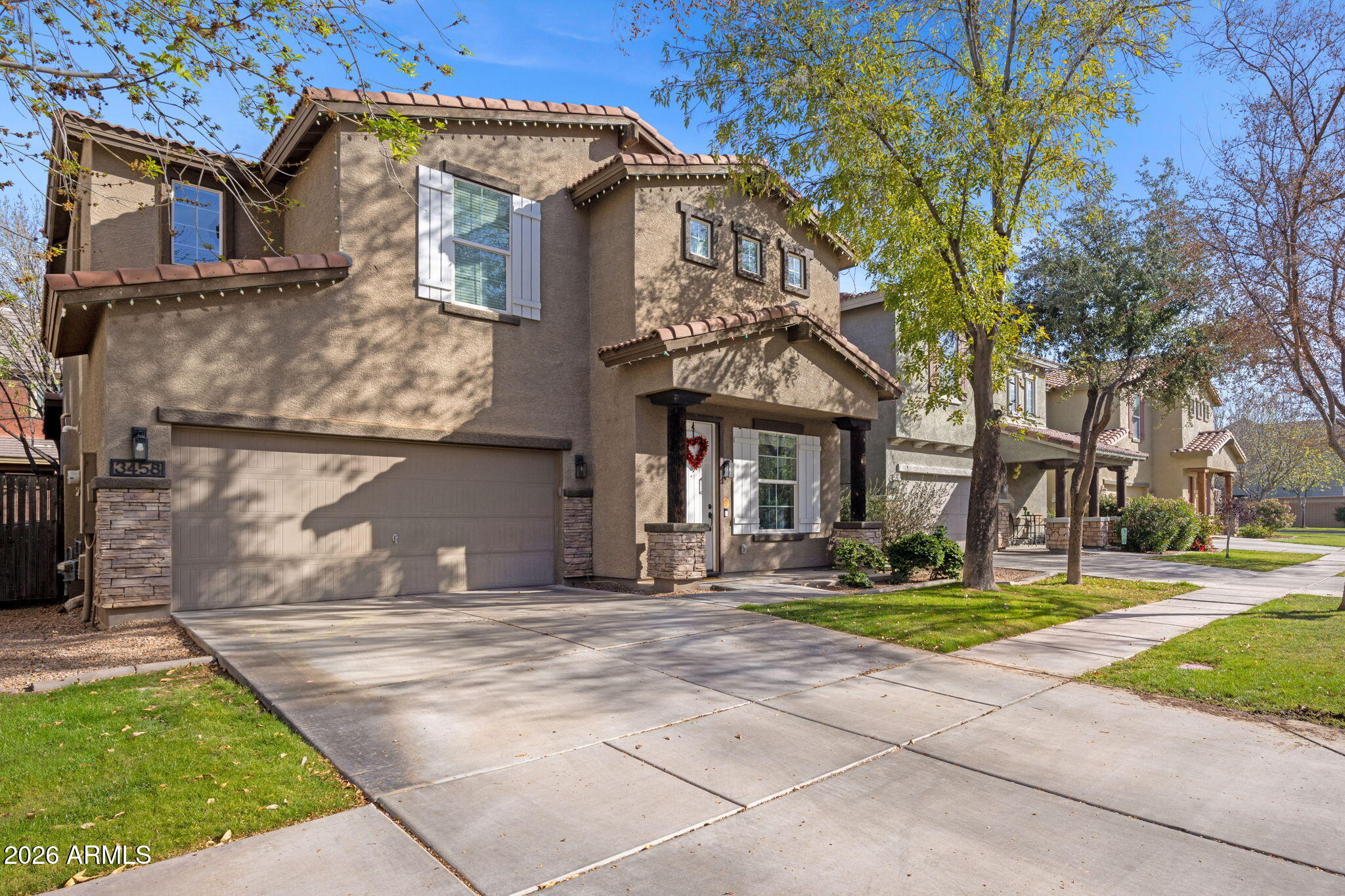 3458 East Robin Lane Gilbert, AZ 85296 - Photo 2 of 32 a front view of a house with a yard