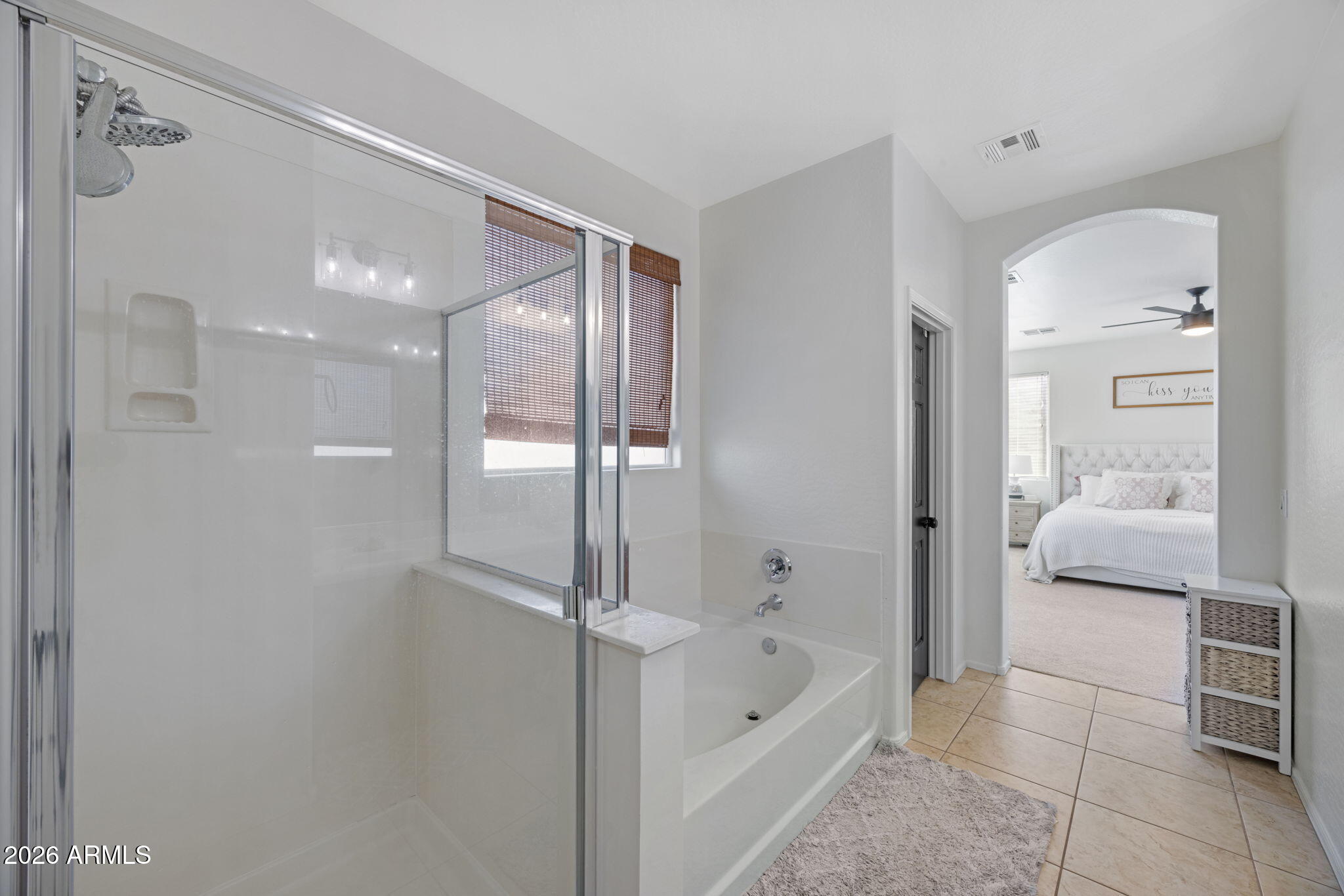 3458 East Robin Lane Gilbert, AZ 85296 - Photo 22 of 32 a bathroom with a bathtub and a shower