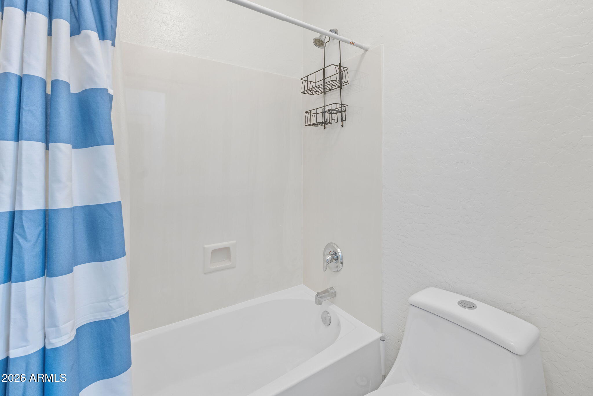3458 East Robin Lane Gilbert, AZ 85296 - Photo 27 of 32 a bathroom with a bathtub and shower