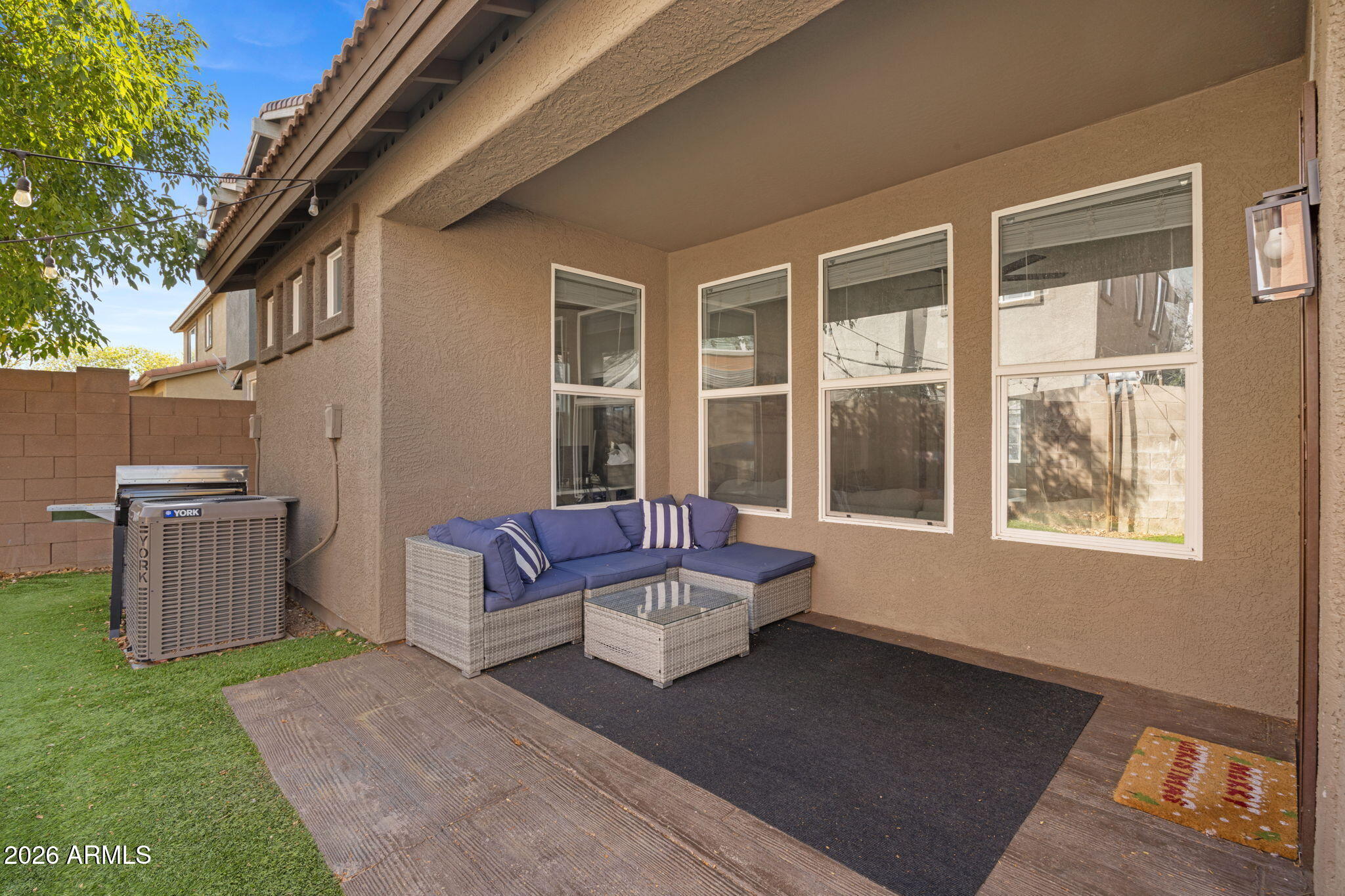 3458 East Robin Lane Gilbert, AZ 85296 - Photo 30 of 32 a living room with furniture and a window