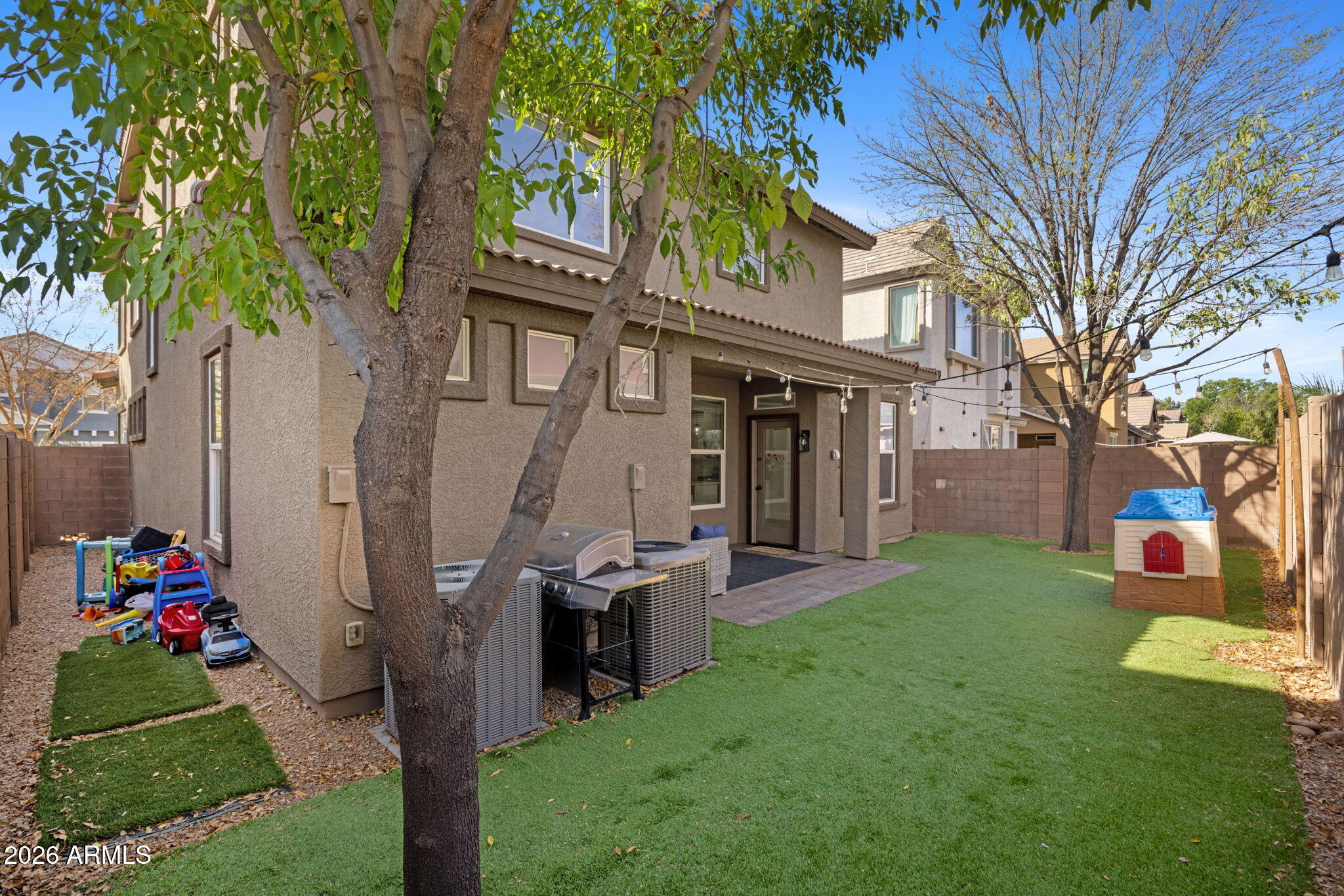 3458 East Robin Lane Gilbert, AZ 85296 - Photo 31 of 32 a front view of a house with a porch and a tree