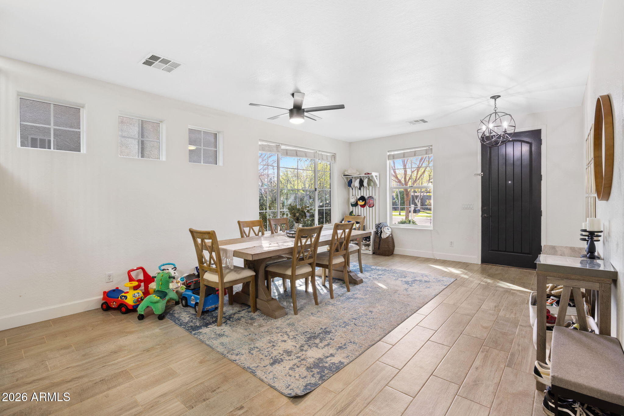 3458 East Robin Lane Gilbert, AZ 85296 - Photo 5 of 32 a view of a dining room with furniture and a chandelier