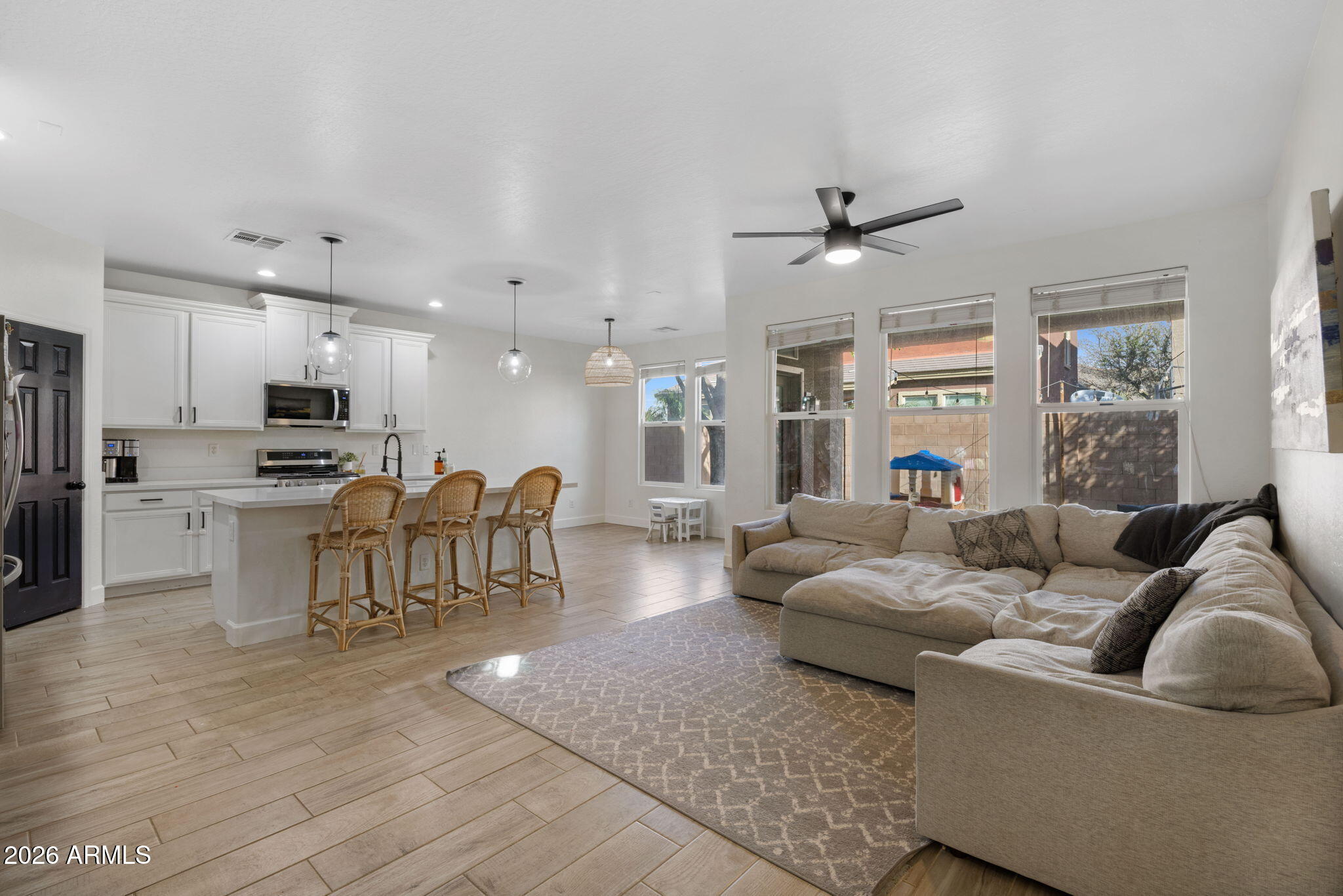 3458 East Robin Lane Gilbert, AZ 85296 - Photo 7 of 32 a living room with furniture and kitchen view