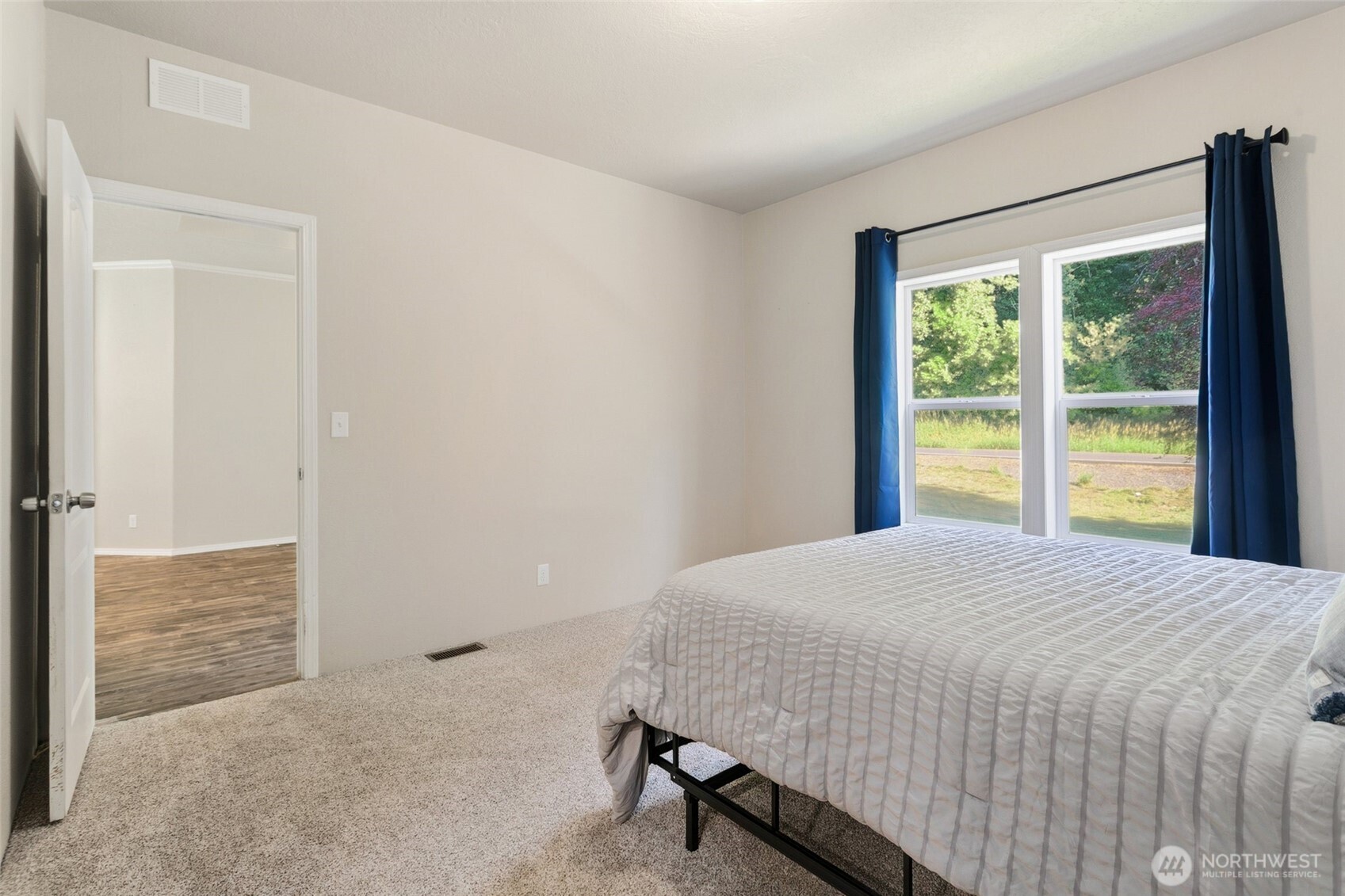 492 Coal Creek Road Chehalis, WA 98532 - Photo 13 of 38 a bedroom with a bed and a large window