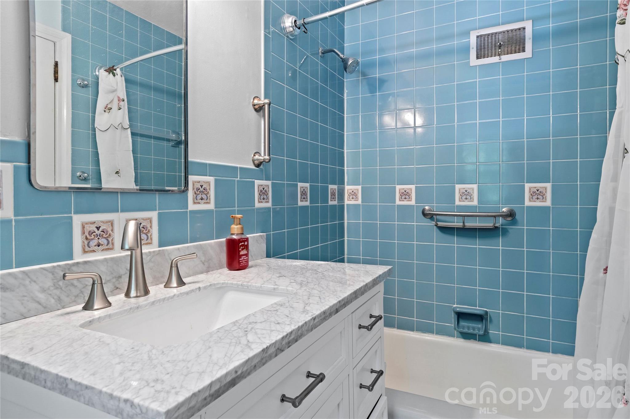 951 Dodson Mill Road Pilot Mountain, NC 27041 - Photo 23 of 48 a bathroom with a granite countertop bathtub a sink and a shower