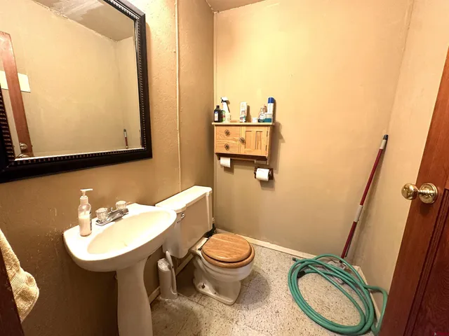 a living room with lots of furniture and rug floor