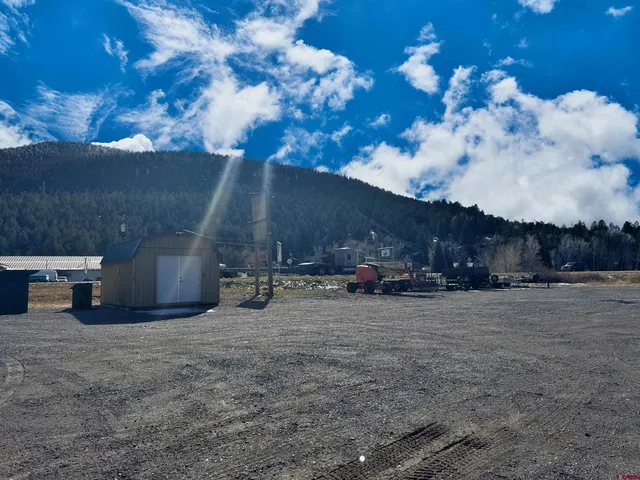 a view of a house with a cars park