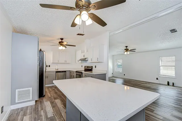 a view of kitchen and center island