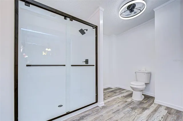 a bathroom with a toilet a sink and a mirror