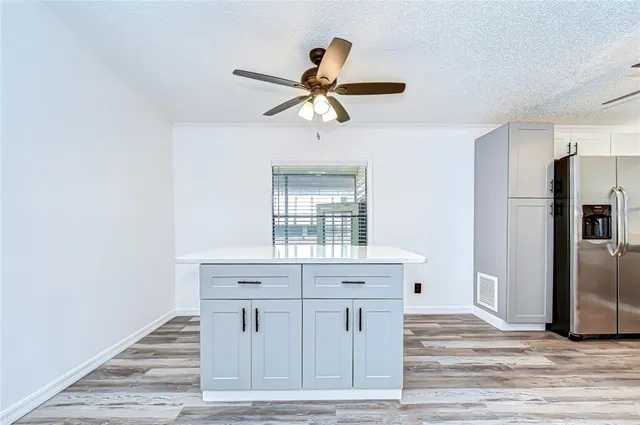 a kitchen with a refrigerator a sink and dishwasher