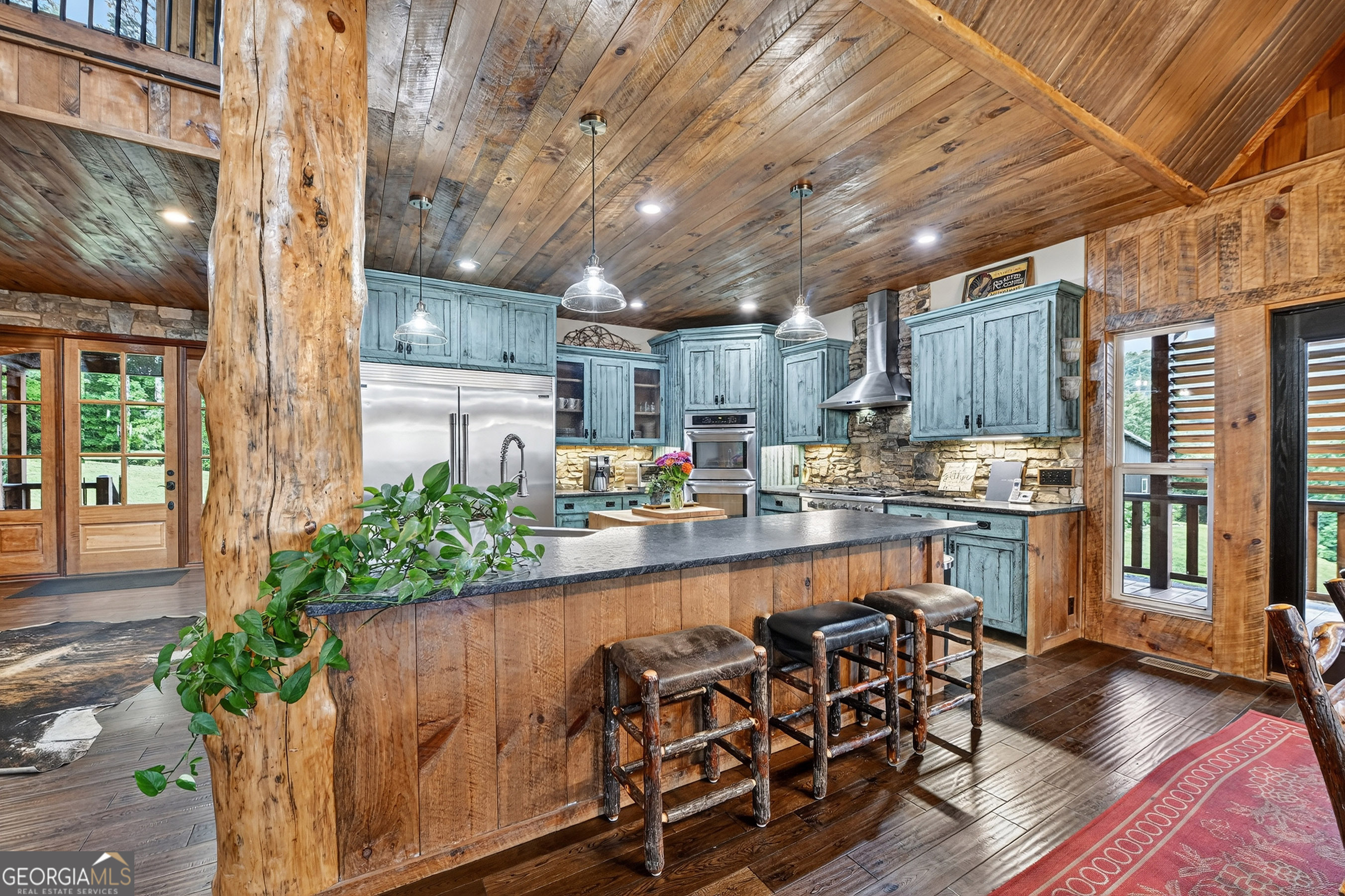 785 Wehunt Road Epworth, GA 30541 - Photo 12 of 73 a kitchen with lots of counter top space and wooden floor
