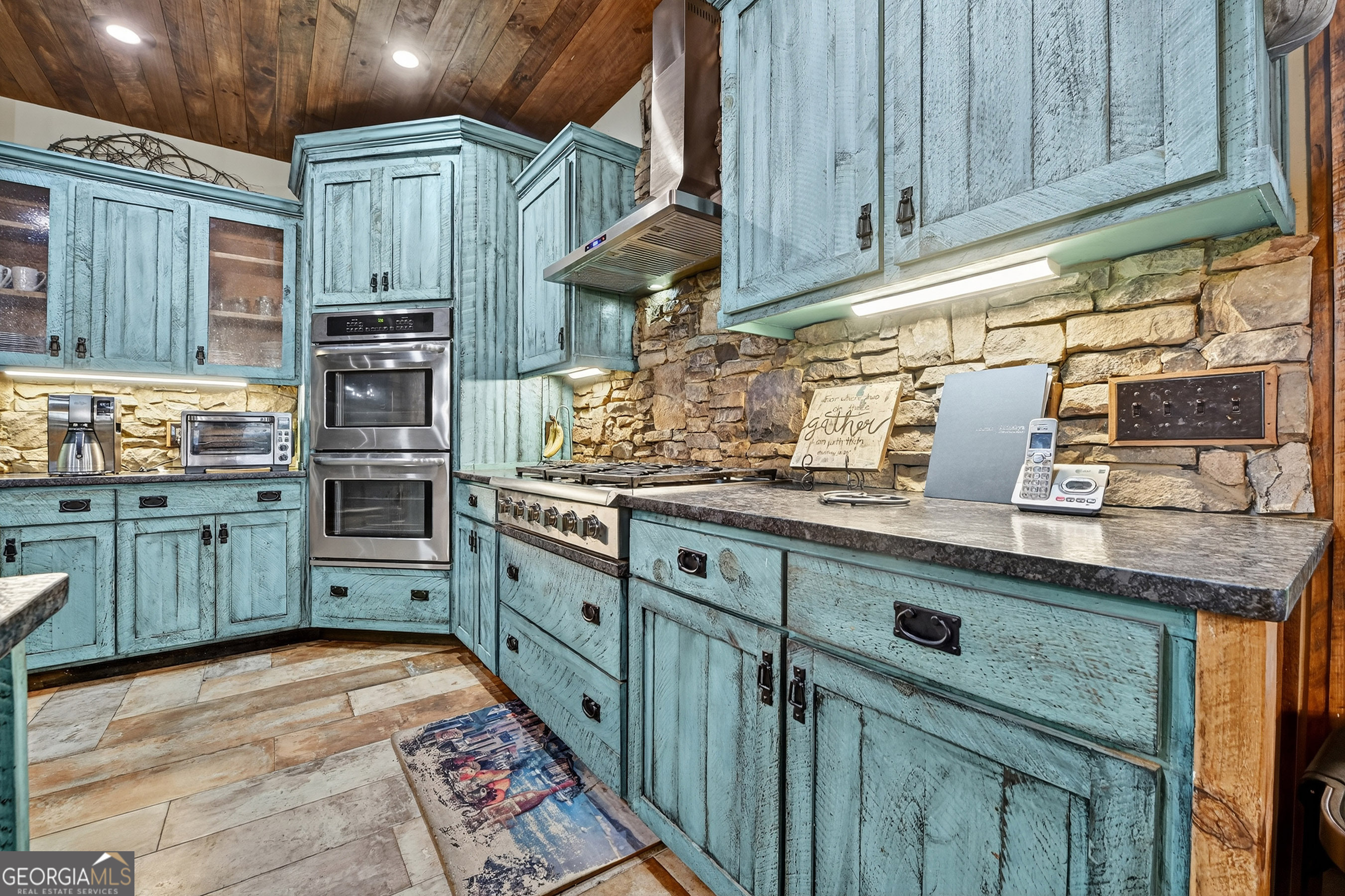 785 Wehunt Road Epworth, GA 30541 - Photo 13 of 73 a kitchen with stainless steel appliances granite countertop a sink a stove and cabinets