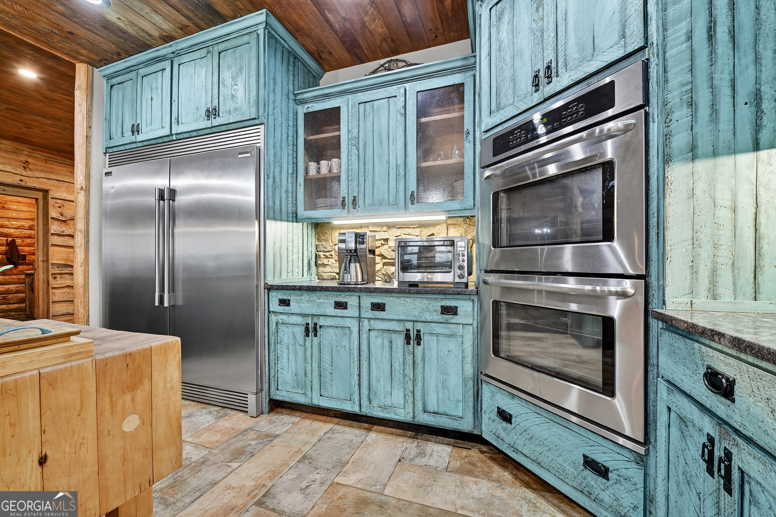 785 Wehunt Road Epworth, GA 30541 - Photo 14 of 73 a kitchen with granite countertop stainless steel appliances and wooden cabinets