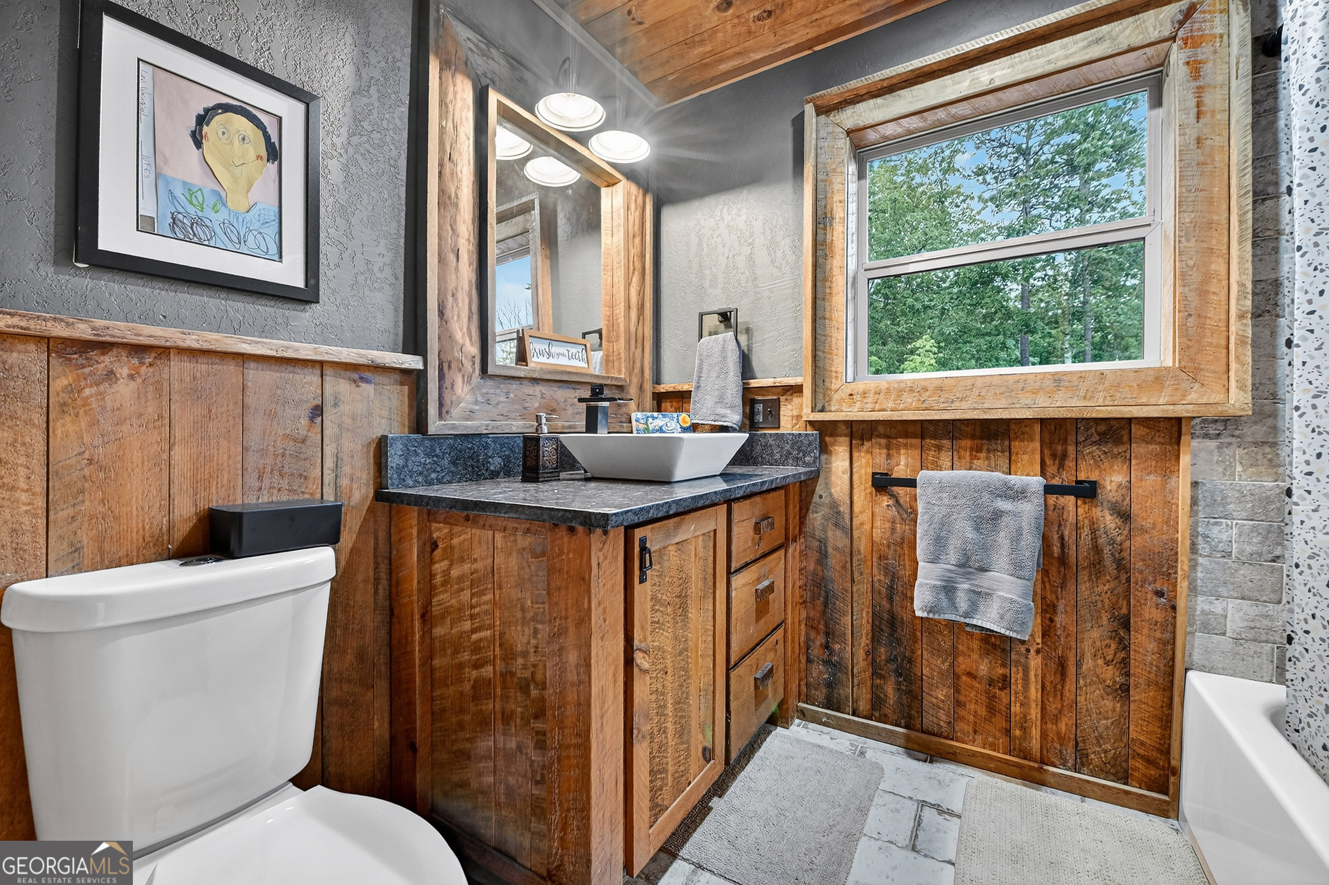 785 Wehunt Road Epworth, GA 30541 - Photo 31 of 73 a bathroom with a granite countertop toilet sink and tub