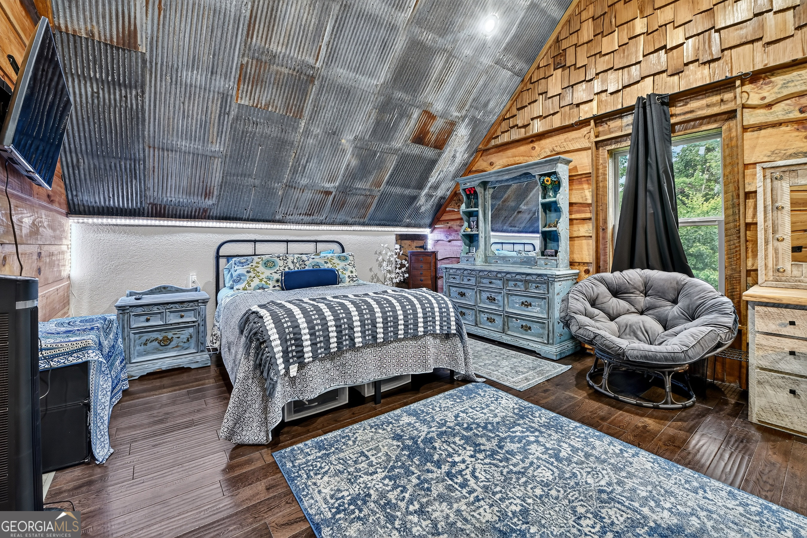 785 Wehunt Road Epworth, GA 30541 - Photo 32 of 73 a bedroom with furniture and a fireplace