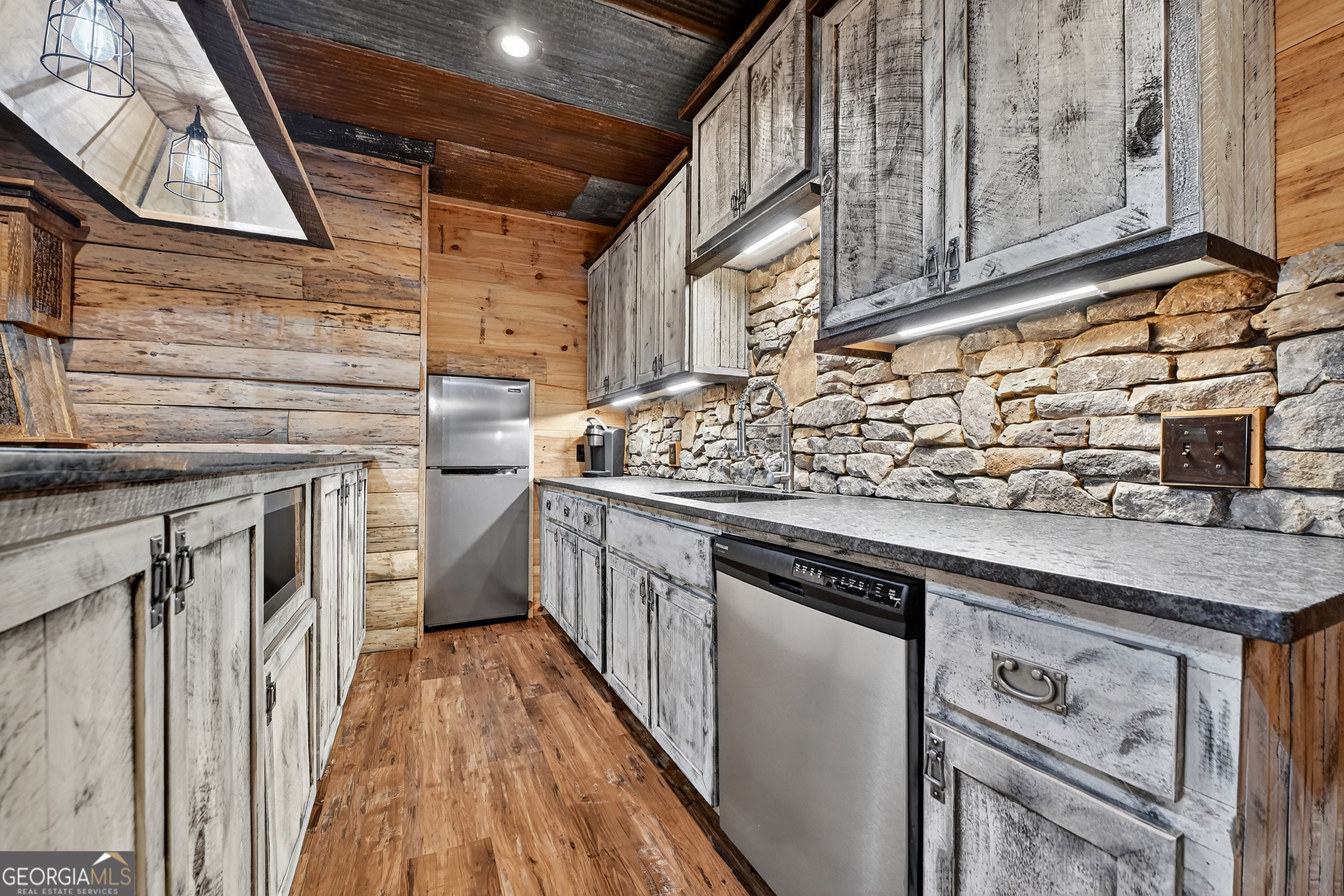 785 Wehunt Road Epworth, GA 30541 - Photo 38 of 73 a kitchen with stainless steel appliances granite countertop a stove and a sink