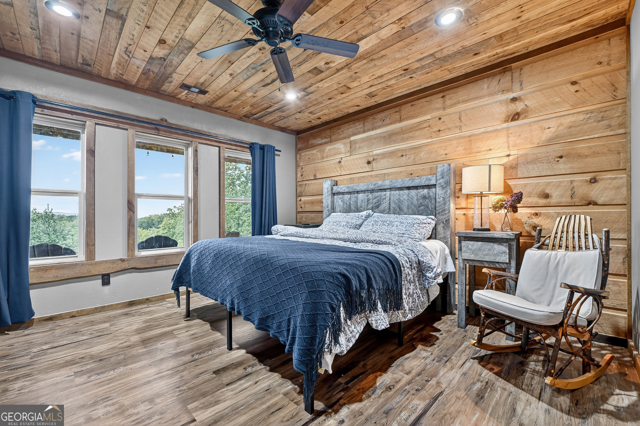 785 Wehunt Road Epworth, GA 30541 - Photo 40 of 73 a spacious bedroom with a bed a chair and next to a window