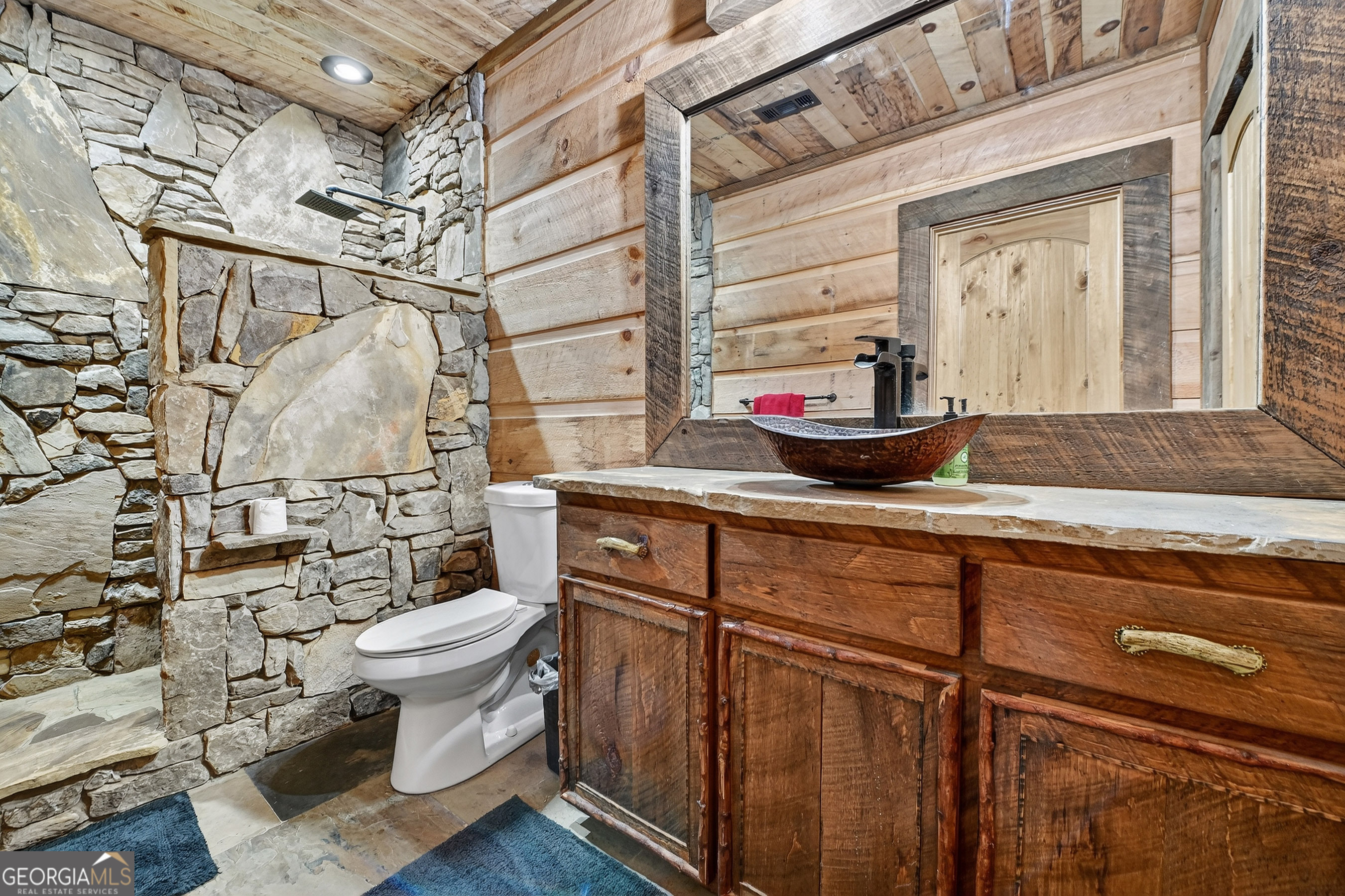 785 Wehunt Road Epworth, GA 30541 - Photo 46 of 73 a bathroom with a granite countertop sink toilet and shower