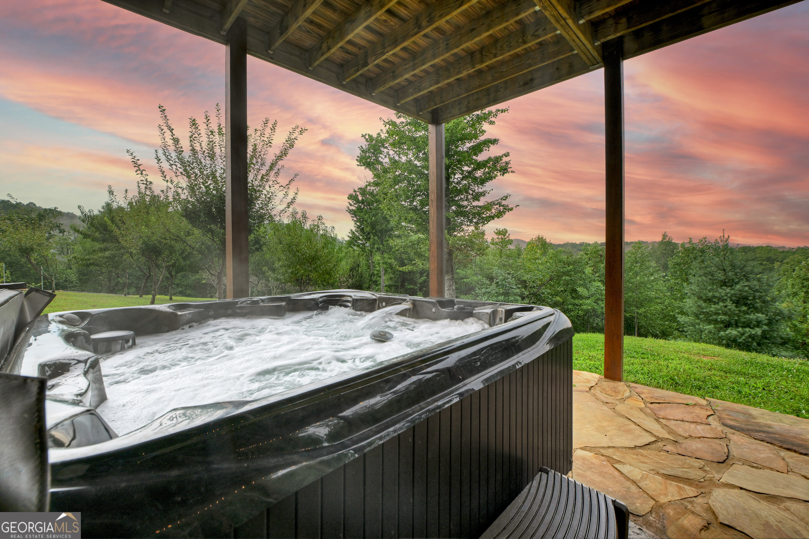785 Wehunt Road Epworth, GA 30541 - Photo 51 of 73 a view of a patio with a table and chairs