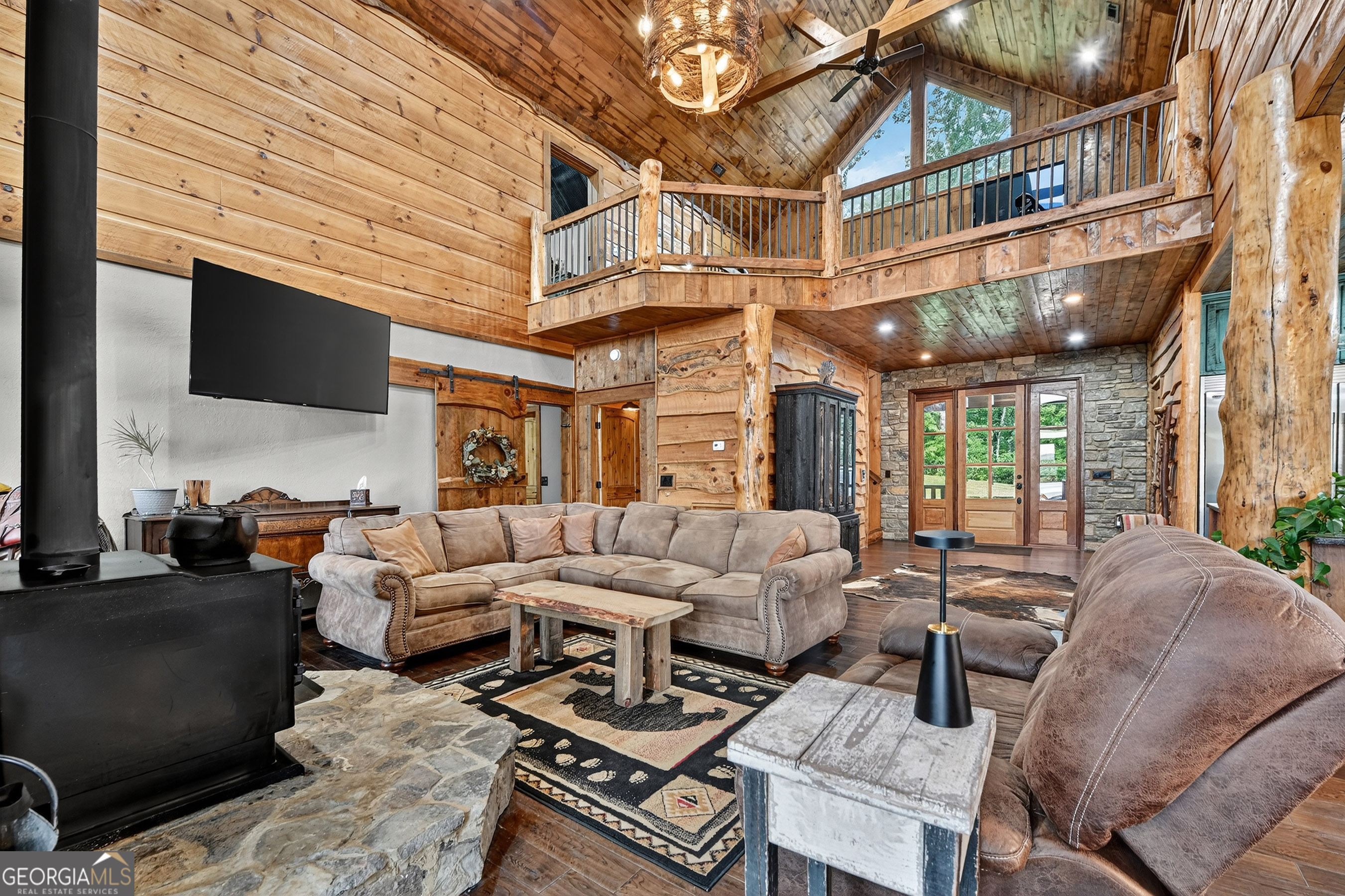 785 Wehunt Road Epworth, GA 30541 - Photo 8 of 73 a living room with furniture a flat screen tv and a fireplace