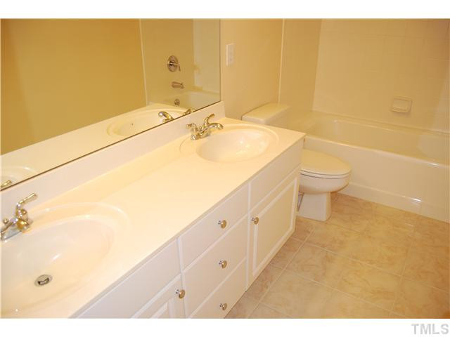 107 Nouveau Avenue Raleigh, NC 27615 - Photo 14 of 25 Upstairs features two full baths, both with tile in excellent condition! This bathroom features double vanities!