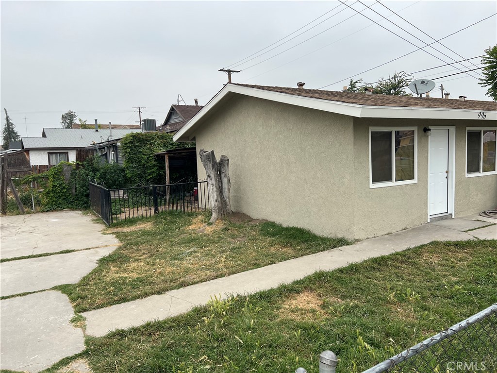 996 North Crescent Avenue San Bernardino, CA 92410 - Photo 1 of 10 a view of a house with a yard