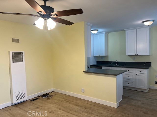 996 North Crescent Avenue San Bernardino, CA 92410 - Photo 4 of 10 a kitchen with a sink a refrigerator and cabinets