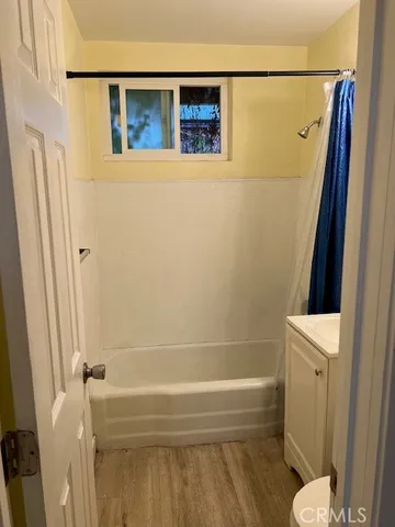 a bathroom with a shower and a toilet